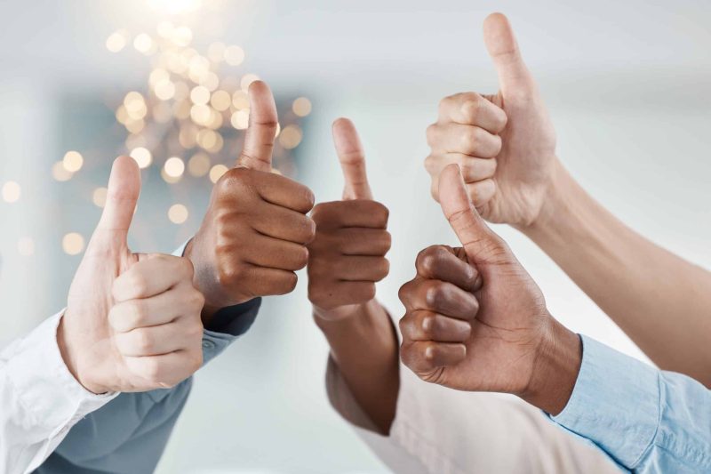 Thumbs up, success hands and teamwork collaboration of office diversity team feeling job community. Thank you, winner and yes hand sign of people and staff together showing happy and goal gesture.